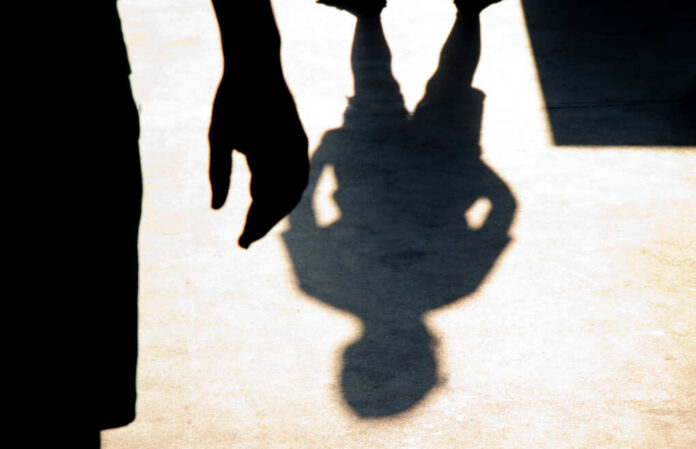 Blurry,Shadow,Silhouette,Of,Two,Boys,Confronting,Each,Other,In