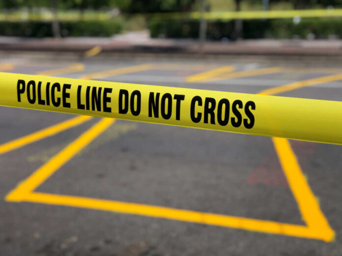 Police,Line,Do,Not,Cross,Barricade,Along,A,City,Street