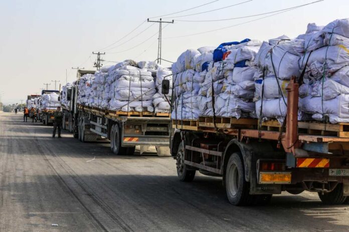 Palestinian,Trucks,Loaded,With,Humanitarian,Aid,Cross,Through,The,Karem