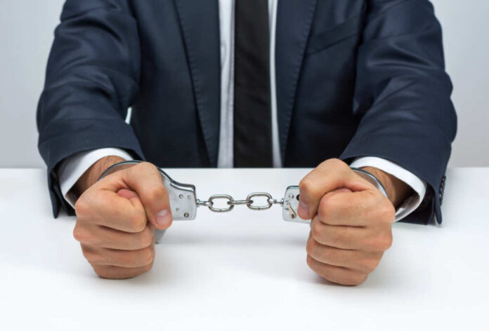 Businessman,With,Handcuffs