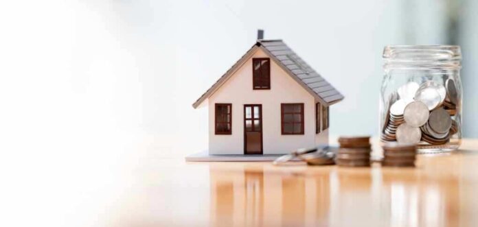 Real,Estate,Concept,Background.,House,Model,And,Coins,Stack,On