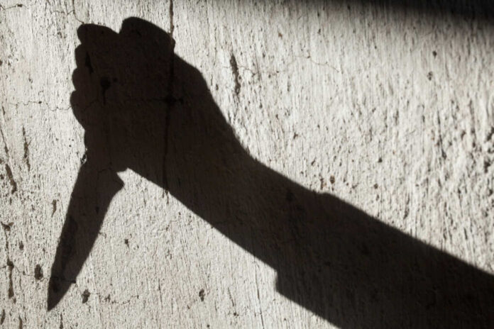 Shadow,Of,The,Hand,Holding,A,Big,Sharp,Knife.,Murderer,