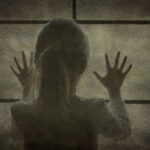 HORRIFYING Discovery: Children Living With Corpse Silhouette of a child with hands pressed against a window, looking outside