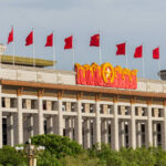 Facade of the National Museum of China adorned with red flags and decorative elements