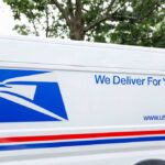 USPS delivery van with the slogan We Deliver For You.