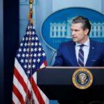 Pentagon Ultimatum: AI Ethics Showdown Looms A government official speaking at a podium in front of the White House seal and American flag