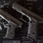 3D Guns Revolutionize Global Conflict Two Glock handguns displayed on a schematic background
