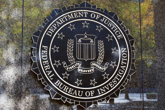shutterstock_1733876597.jpg FBI seal displayed on a building exterior