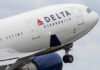 Close-up of a Delta Airlines airplane during takeoff