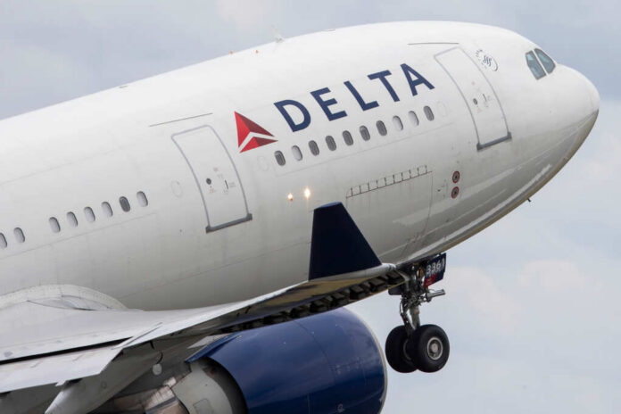Close-up of a Delta Airlines airplane during takeoff