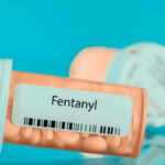 Prescription bottle labeled Fentanyl with pills inside
