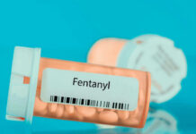 Prescription bottle labeled Fentanyl with pills inside