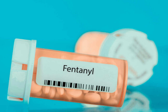 shutterstock_2139511935.jpg Prescription bottle labeled Fentanyl with pills inside