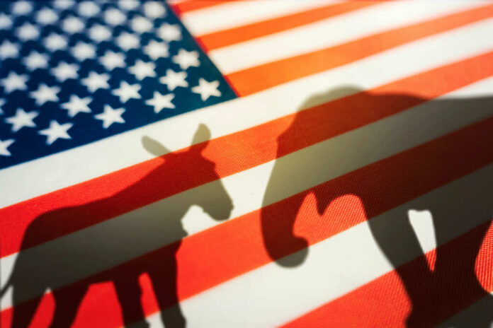 shutterstock_2193751699.jpg Shadows of a donkey and elephant on an American flag