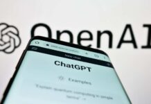20-Year-Old Intern Sparks AI Revolution Close-up of a smartphone displaying the ChatGPT interface with the OpenAI logo in the background