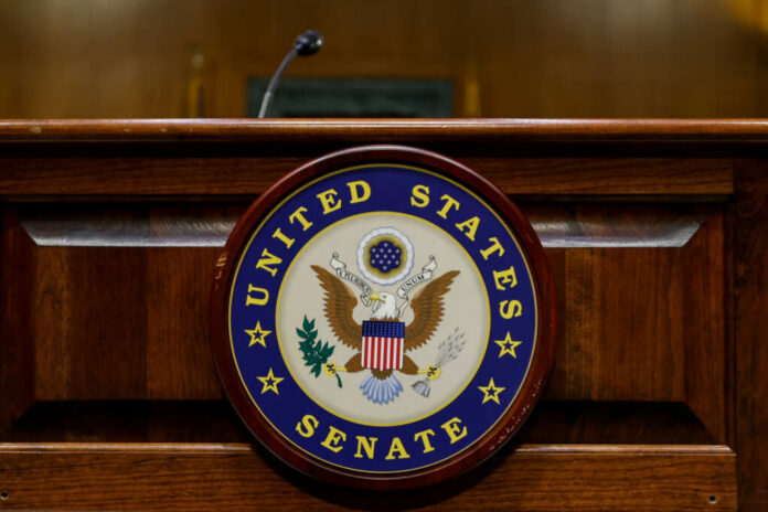 Close-up of the United States Senate seal on a wooden podium