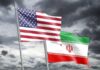 Unclear War Goals Stir Debate in Washington Flags of the United States and Iran waving against a cloudy sky