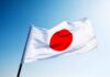 Middle East Chaos Triggers Japan’s Coal Comeback Japanese flag with a red circle on a white background waving against a blue sky