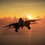 Military aircraft flying against a sunset backdrop