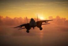 Military aircraft flying against a sunset backdrop
