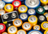 A close-up view of various colorful batteries arranged together