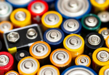 A close-up view of various colorful batteries arranged together