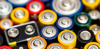 A close-up view of various colorful batteries arranged together