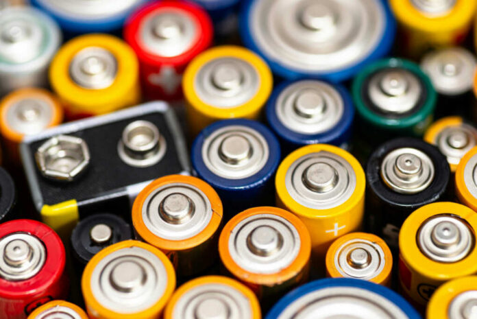 shutterstock_2491566843.jpg A close-up view of various colorful batteries arranged together
