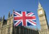 Union Jack flag in front of Big Ben and the Houses of Parliament