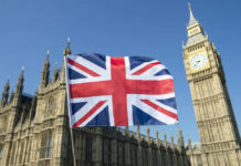 Union Jack flag in front of Big Ben and the Houses of Parliament