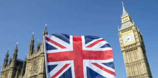 Union Jack flag in front of Big Ben and the Houses of Parliament