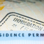 Judge Blocks Trump’s Somali Deportation Protections Close-up of a residence permit showing immigration details