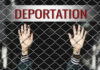 Hands reaching through a metal fence with the word DEPORTATION above