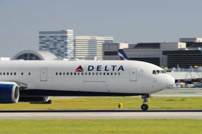 Delta Airlines airplane taxiing on the runway at an airport