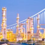 Oil ROCKETS Past $100—Blockade Sparks Crisis Illuminated industrial oil refinery with a growth graph overlay
