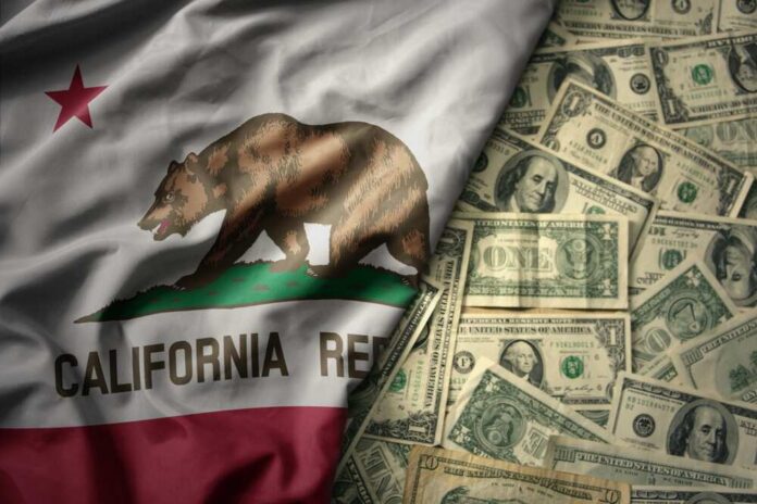 shutterstock_2335779031.jpg California state flag featuring a bear overlaid on a background of U.S. dollar bills
