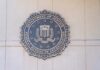 FBI seal mounted on a wall, representing the Federal Bureau of Investigation