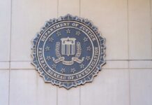 FBI seal mounted on a wall, representing the Federal Bureau of Investigation