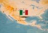 Map of North America with a flag of Mexico pinned on it