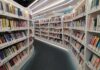 Interior view of a modern library with bookshelves filled with colorful books