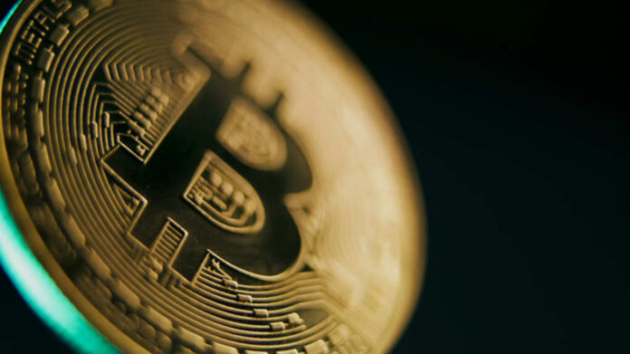 shutterstock_2491707327.jpg Close-up of a Bitcoin coin showcasing its intricate design