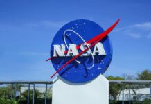 NASA logo displayed against a clear blue sky