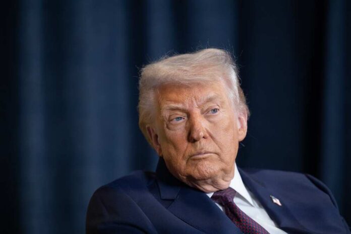 Donald Trump with a serious expression during a media appearance