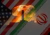 An artistic representation of the US and Iran flags with a nuclear explosion in the background