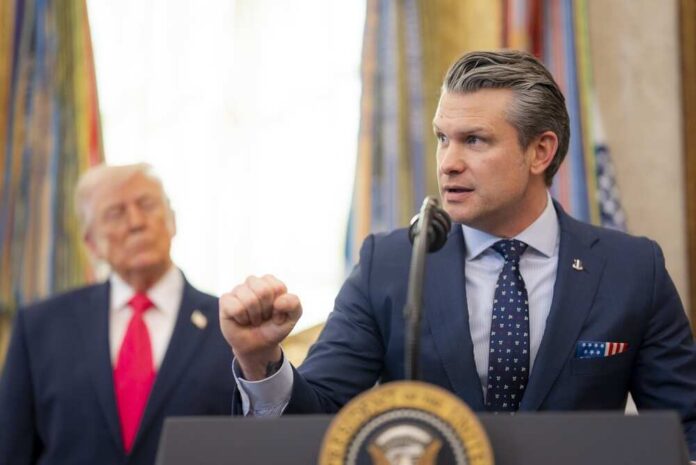A government official delivering a speech at a podium with a presidential seal