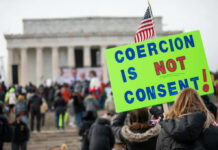 Second American Revolution: Fear Grips Washington A crowd at a protest with a sign reading COERCION IS NOT CONSENT! in front of the Lincoln Memorial