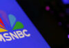Close-up of the MSNBC logo on a blue background
