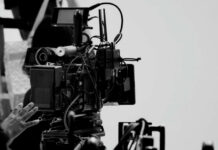 Unseen Battle: Sex Advice Hijacks Public Debate Close-up of a film camera with various cables and equipment in a studio setting