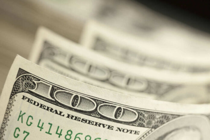 shutterstock_120456253 Close-up of several one hundred dollar bills stacked together