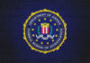 Defector on the Run: FBI’s Massive Reward Announcement FBI emblem on a blue background